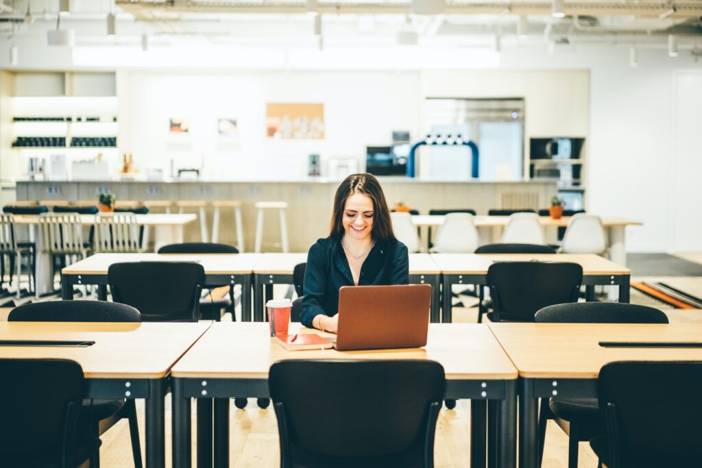 Woman working in a coworking coffee shop