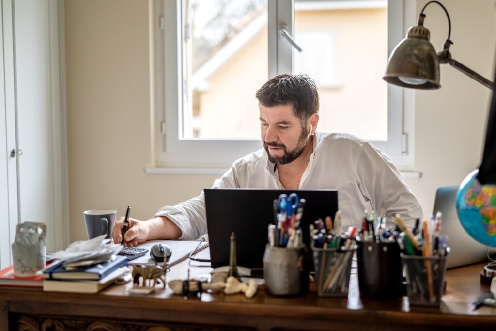 man working from home on a remote work setup