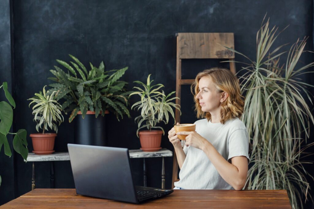 ergonomic work setup woman drinking coffee while working