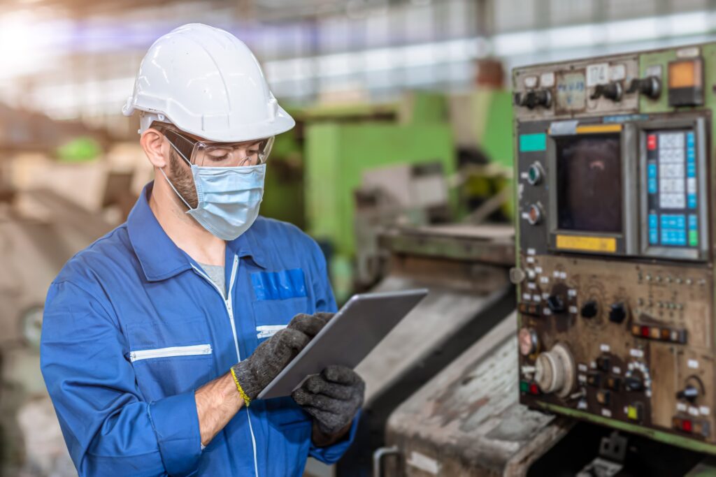 machine industry worker exercising workplace safety measures